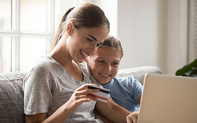 Mother and daughter looking at bank account