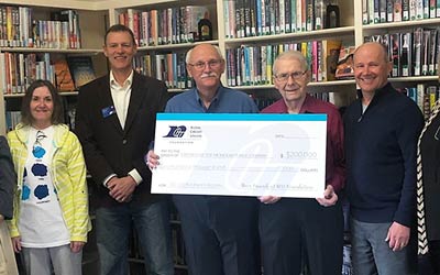 RCU and Mondovi Library folks holding a big check