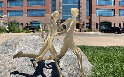 Runners art in front of the corporate center