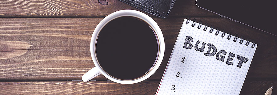 content-6-budgeting-tips-(2).jpg coffee and notepad that says budget