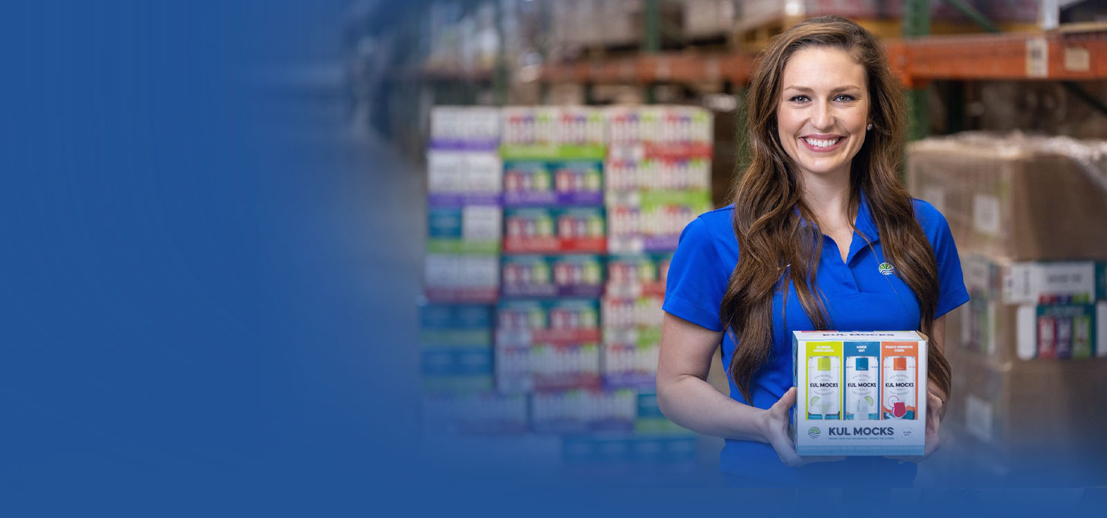 Woman holding her product in the warehouse smiling