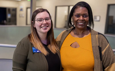 Team members standing in an Office and smiling