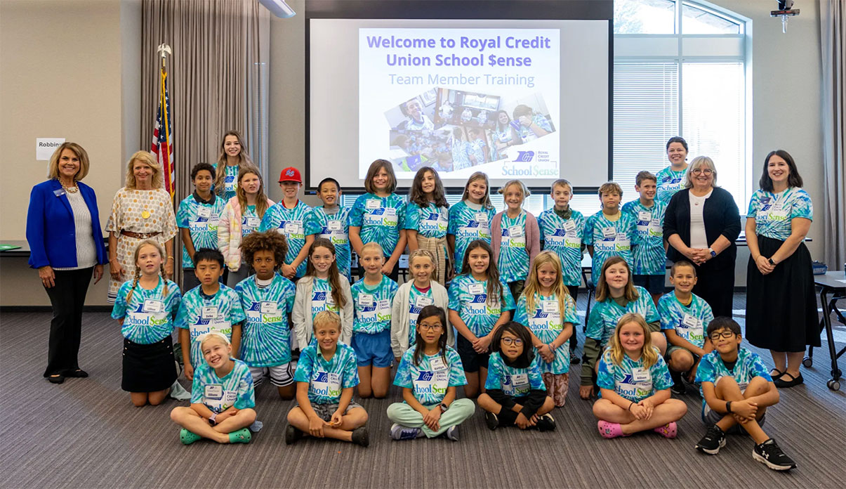 DFI program leaders and kids at RCU corporate Center