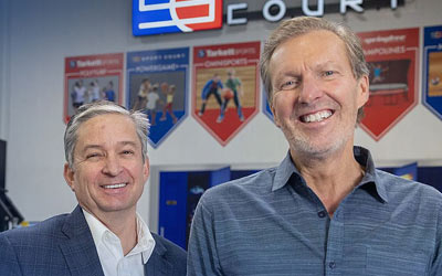 Business owners in front of store