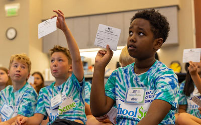 kids working with RCU to learn about finances