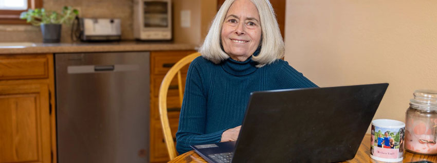 Older woman on her laptop using online banking