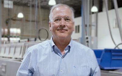 RCU Member standing in his warehouse