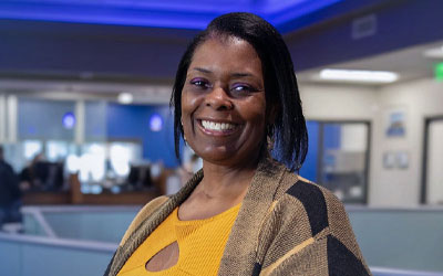 Smiling woman inside an RCU Office
