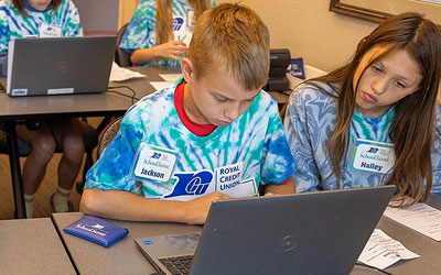 Two young people learning about finances