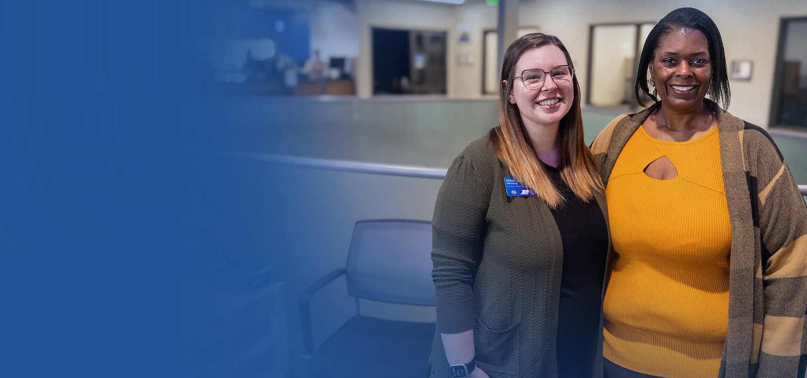 Team members standing in an Office and smiling