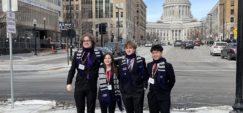 Students standing in front of the capital