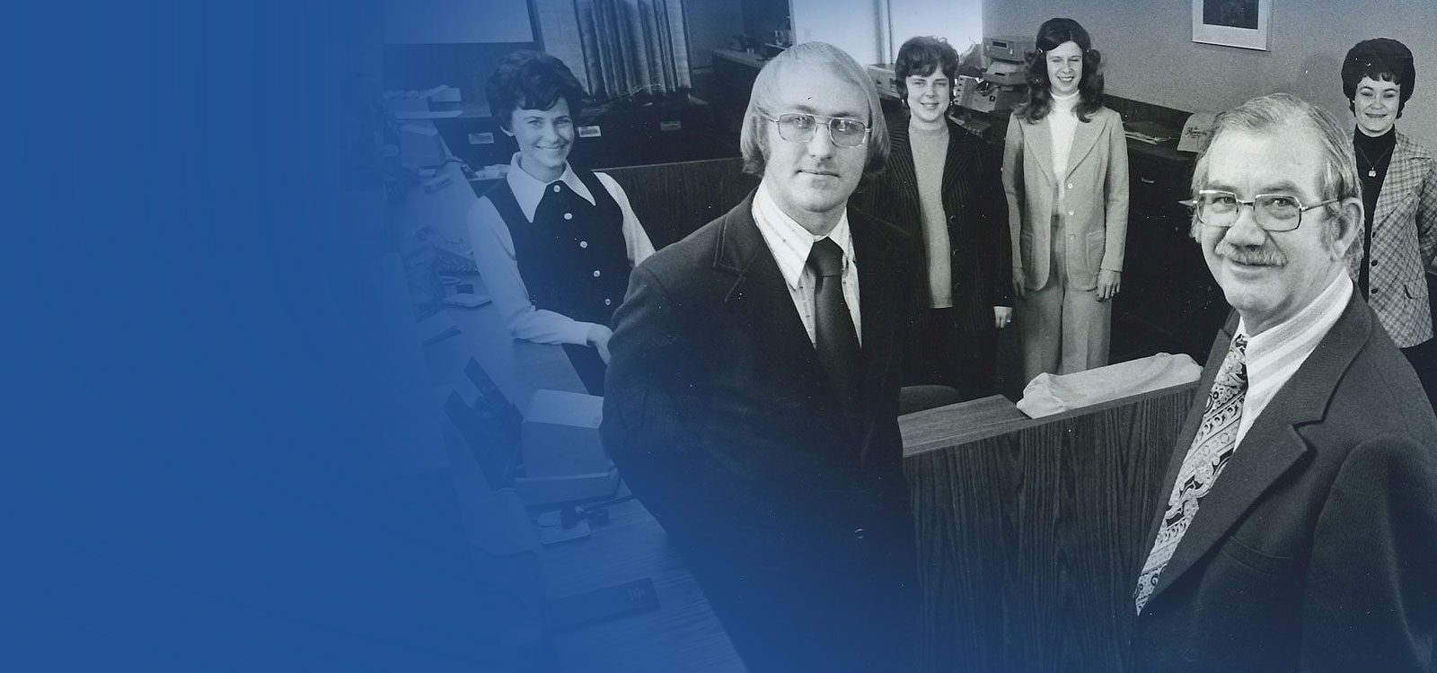 Retro photo of team members at an RCU office