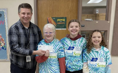 Photo of teacher with School $ense kids