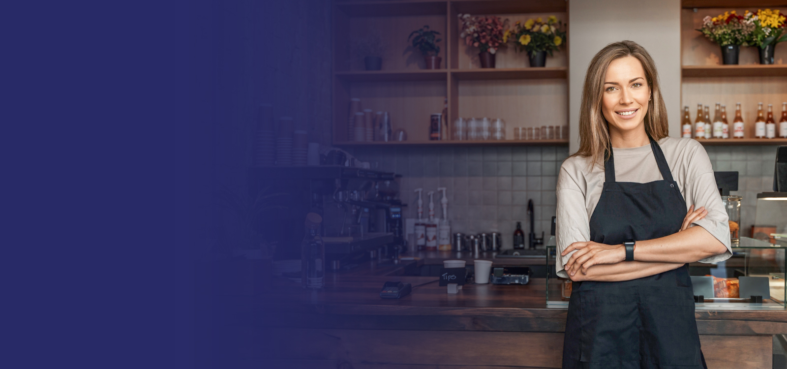 Business owner standing in her shop with $3,000 numbers