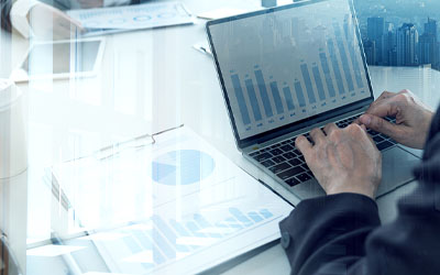 Person working on finances on laptop