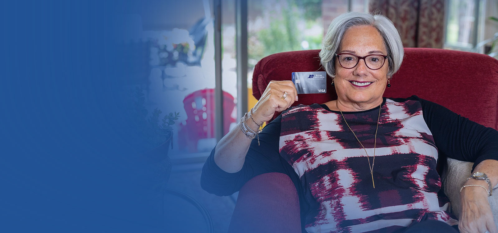 Royal Member holding a credit card