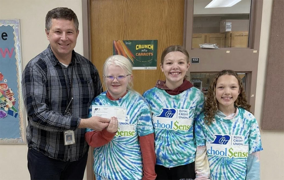 Photo of teacher with School $ense kids