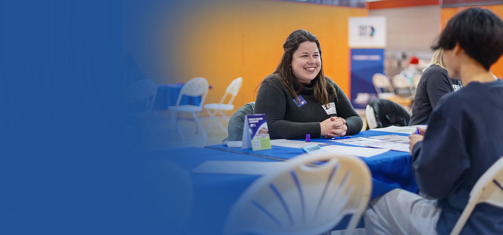 Group of educators with students discussing finances