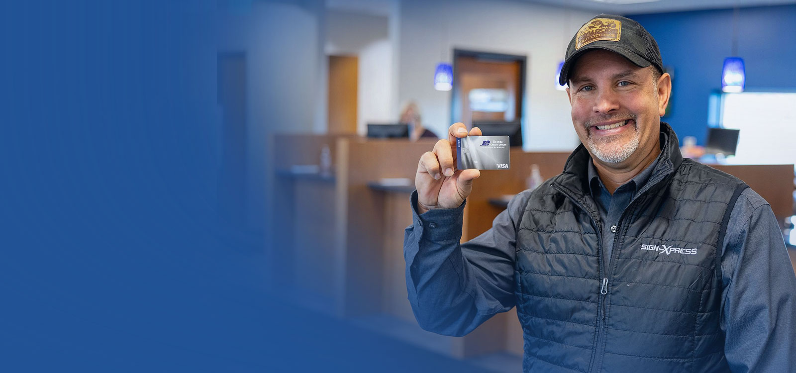 Royal Member holding a Royal card