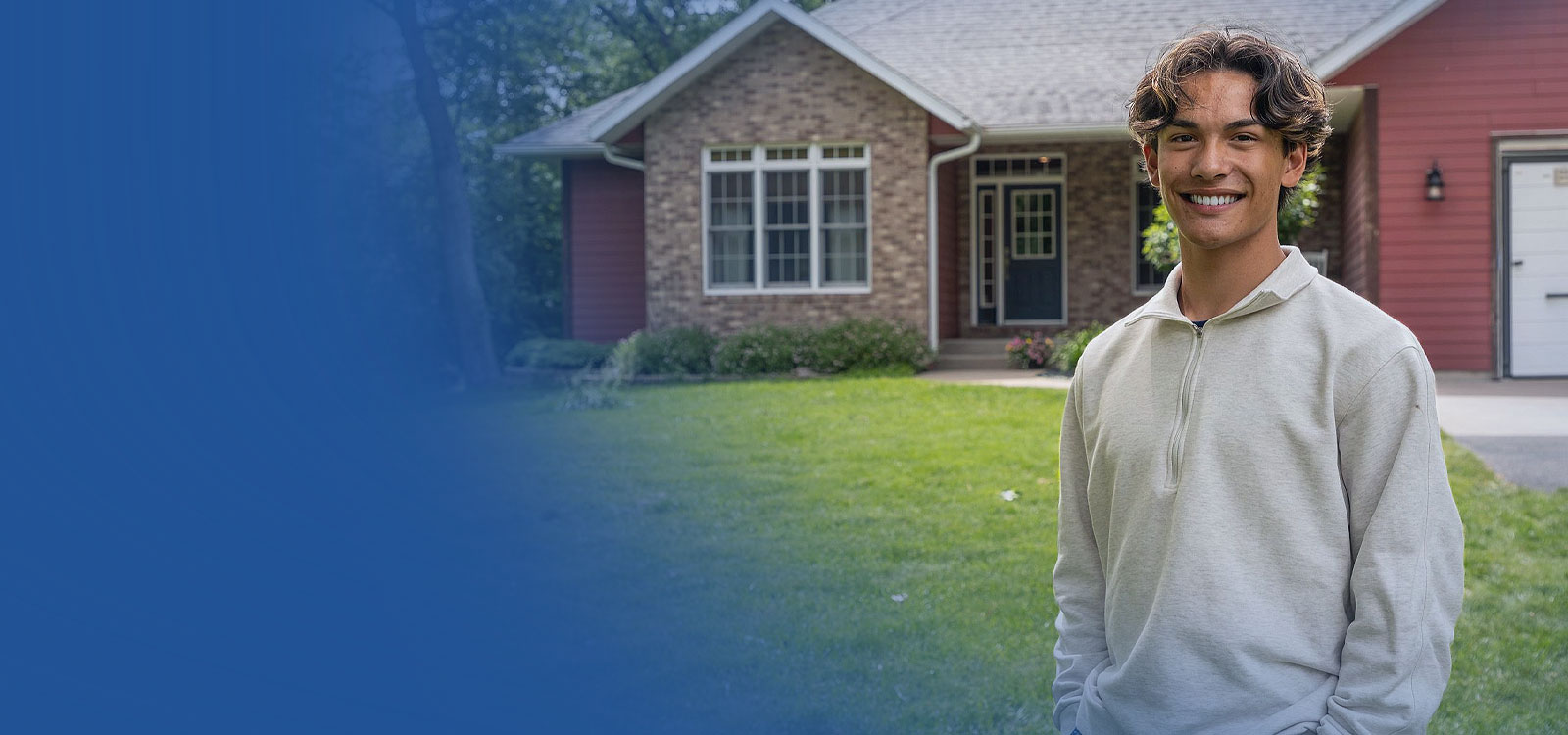 Man standing in front of his home