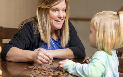 Mother and daughter counting coins