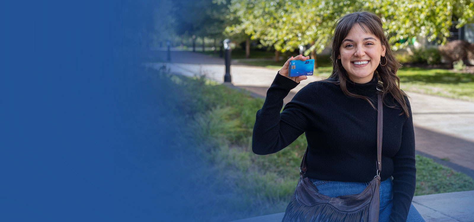 Woman holding an RCU debit card