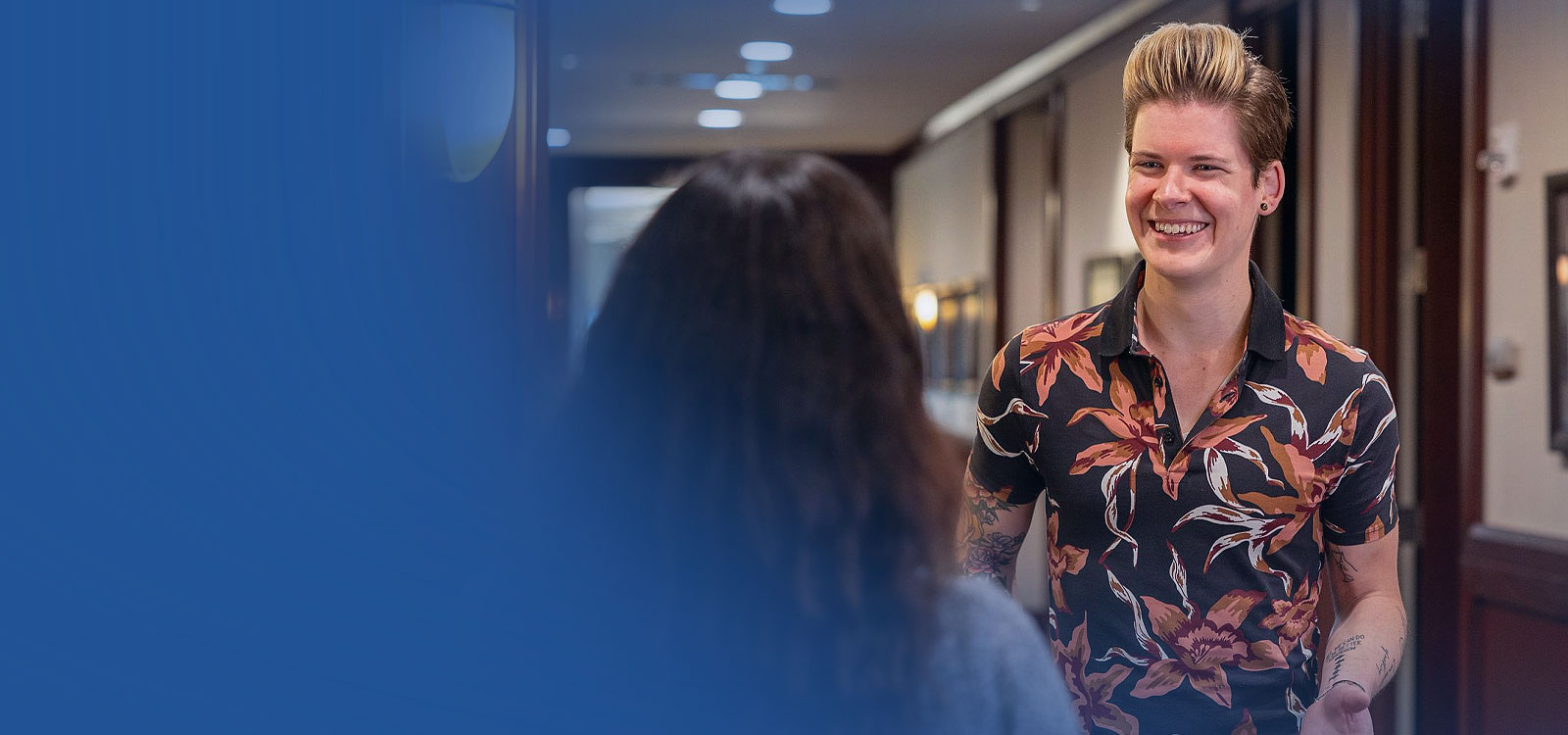 A person at an RCU office working with a team member