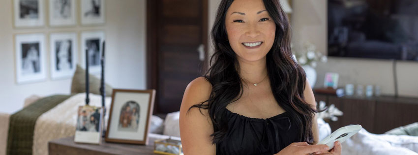 Woman using her cell phone to bank