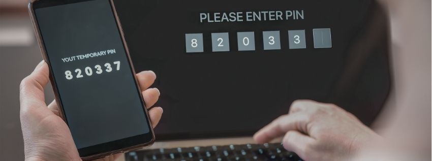 photo of a laptop and phone with secure icon