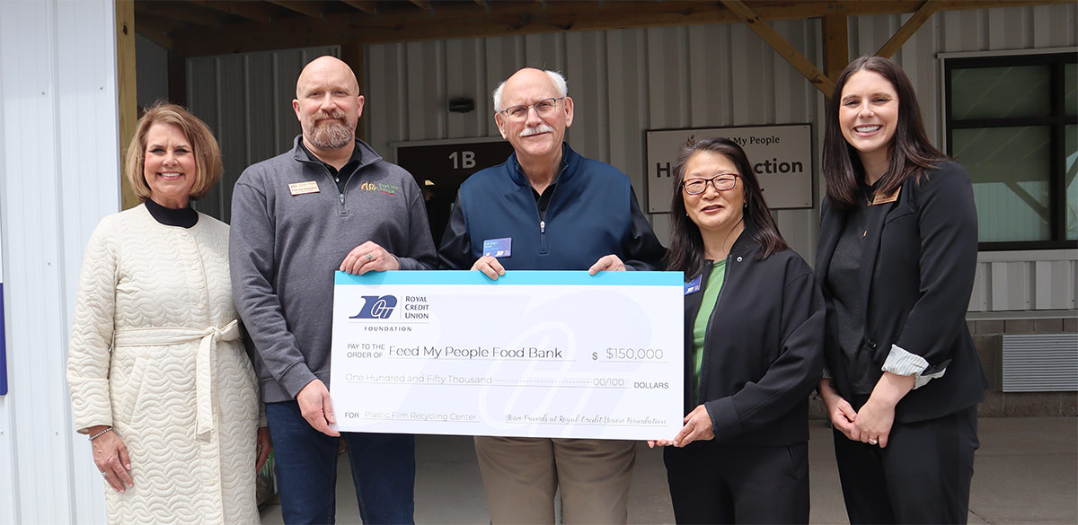 Photo of RCU Leadership holding a big check