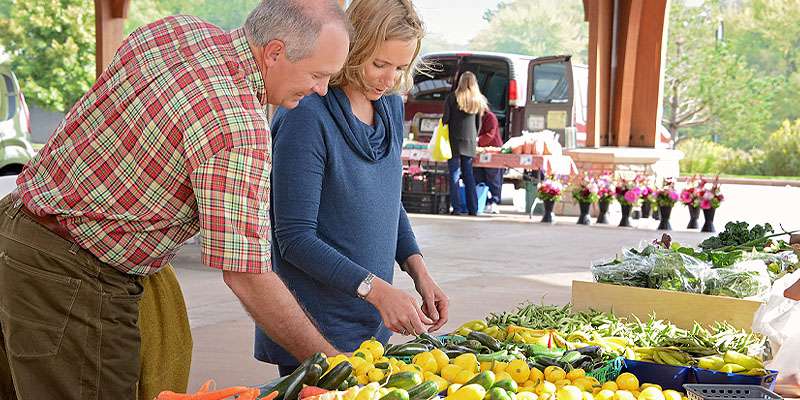 people shopping for produce