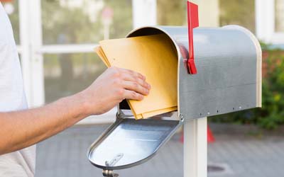 Mailbox and person with mail