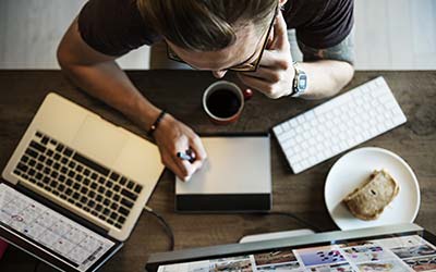 Woman in a small business at computer