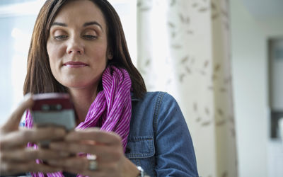 Woman looking at her cell phone