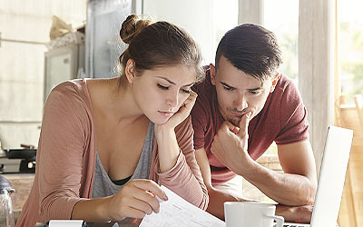 Worried couple looking at finances