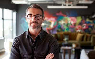 Man standing in his small business