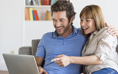 Couple looking at a laptop