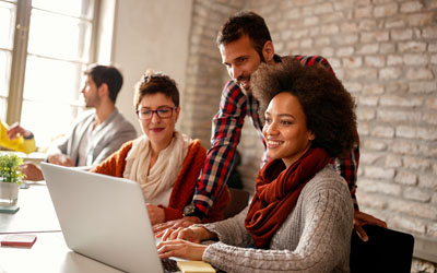 People looking at a laptop