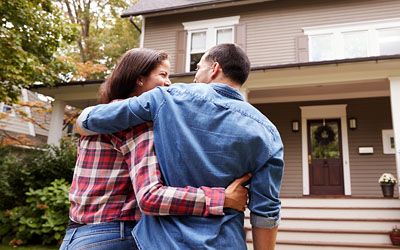 Happy couple entering new home