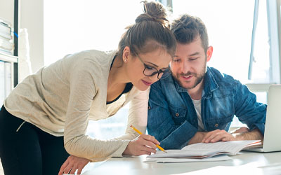 Couple looking at a computer