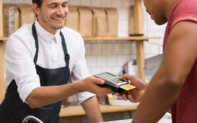 Man swiping a credit card