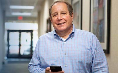 Man using a phone to bank