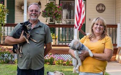 Husband and wife with their pets