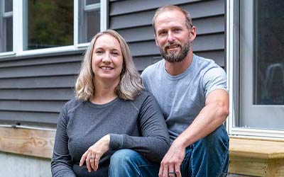 Husband and wife sitting on front porch