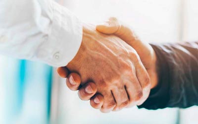 Two business people shaking hands