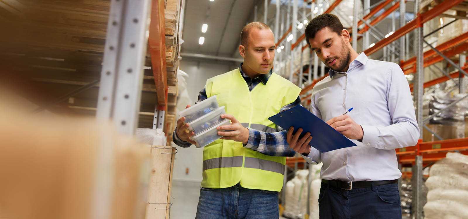 Two men working together in a warehouse