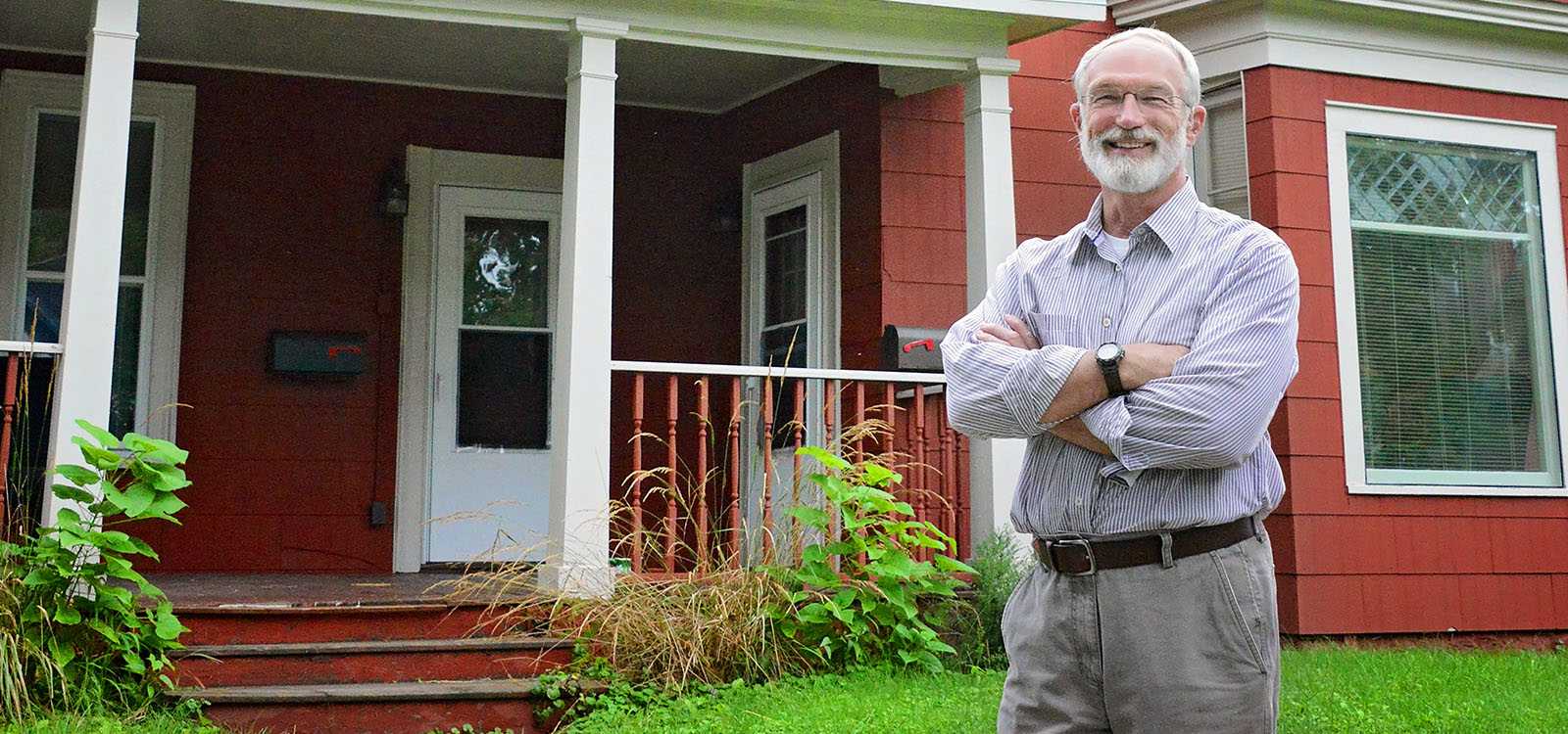 man in front of house