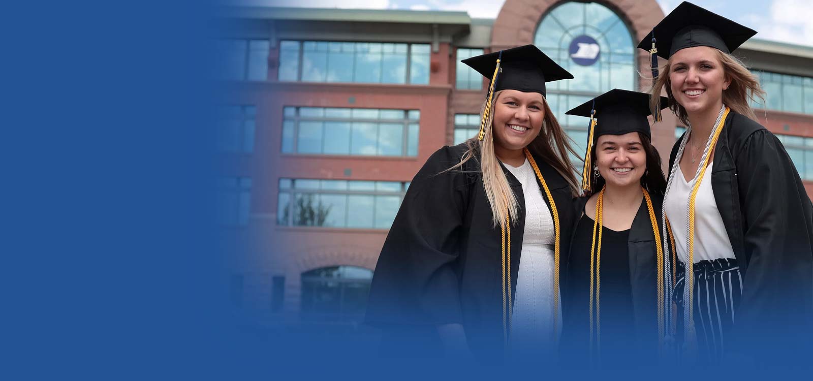 Group of young women with graduation outfits