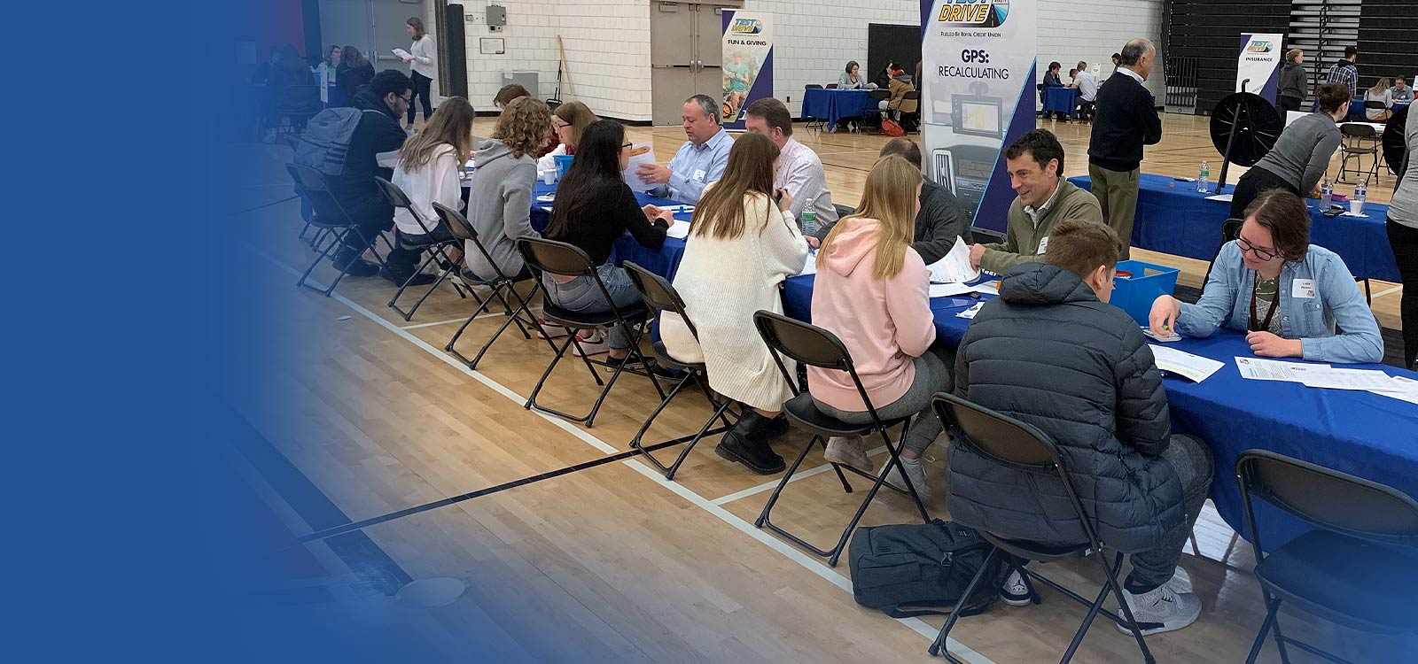 Group of educators with students discussing finances