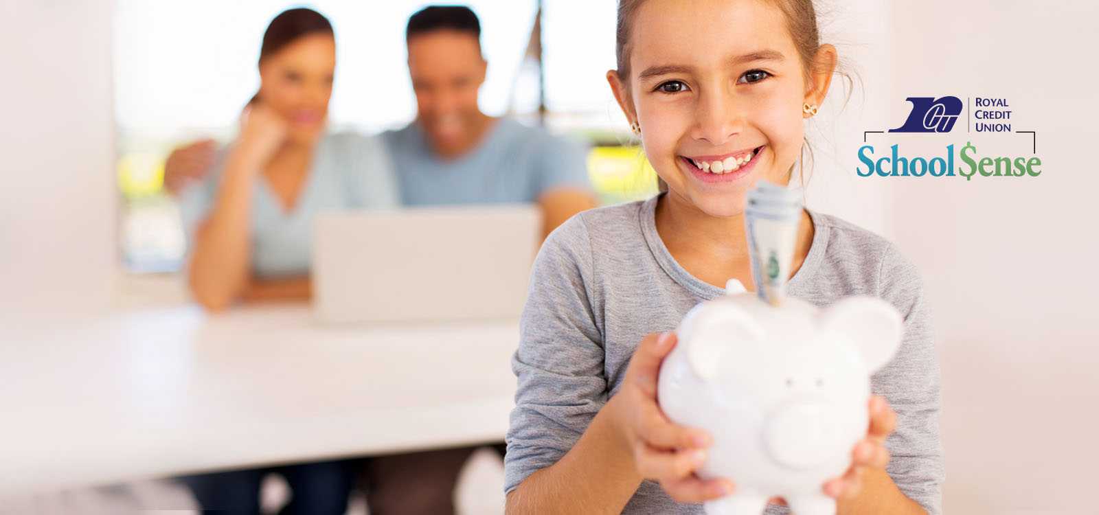 Child holding a piggy bank